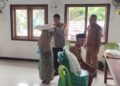 Polsek Panumbangan Polres Ciamis Giat monitoring Penyaluran Bantuan Pangan Nasional Berupa Beras di Desa Sindangherang