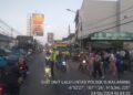 Bhabinkamtibmas dan Unit Patroli Polsek Kadudampit Laksanakan Pengamanan Giat Pawai karnaval Samenan Kenaikan Kelas