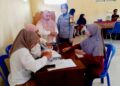 Bhabinkamtibmas Polwan Monitoring Pembagian Bansos Beras